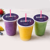 Three smoothie cups with purple, yellow, and green contents with a custom printed cup topper, featuring 'Barry's' branding.